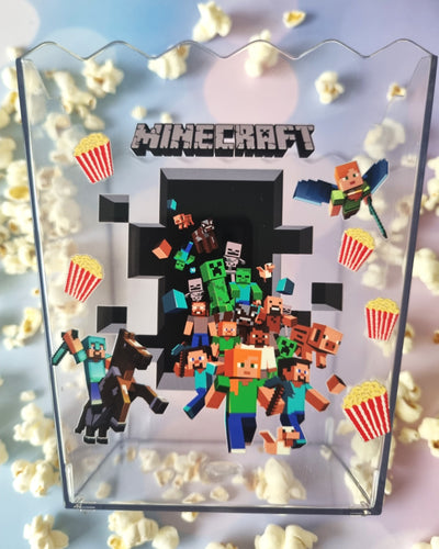 Minecraft-themed display with character figures and popcorn, featuring the Minecraft logo.
