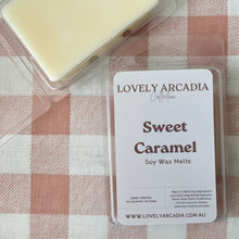 Load image into Gallery viewer, Wax Melt with a 'Sweet Caramel' label on a checkered tablecloth
