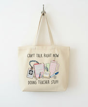 Load image into Gallery viewer, Beige tote bag with teacher-themed design and text on a checkered fabric background
